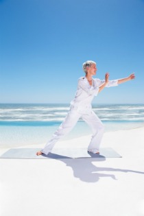 tai chi exercise, woman on beach performing tai chi